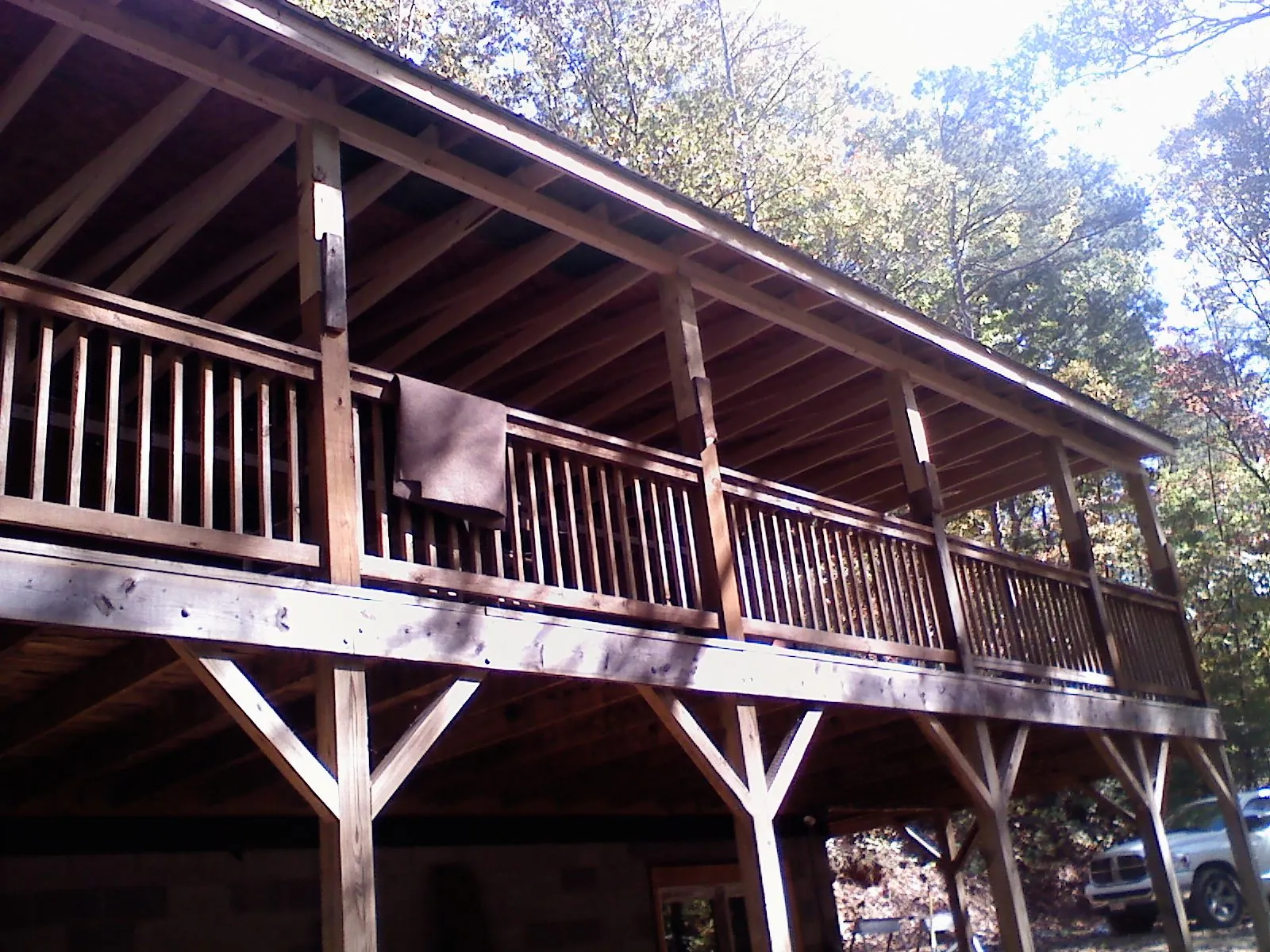 Timber framing under a new elevated porch and deck — Roof Leak Repair in Dekalb by Roofing Brothers